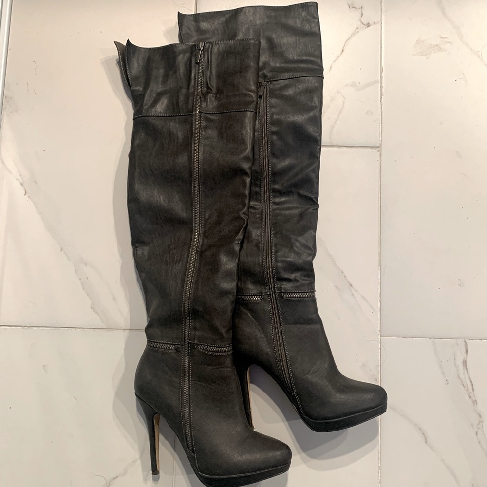 Above the knee high heel boots.